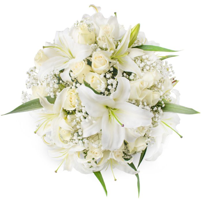 Captured from directly overhead on a stark white surface, this compact round bouquet is a study in monochrome refinement with white oriental lilies and creamy ivory roses arranged in close, even rhythm. The lilies open wide, their trumpet-shaped petals curving gently outward to reveal pale green stamens that punctuate the bouquet's centre, while the roses remain mostly in bud or partial bloom, their concentric petals forming soft, layered rosettes that add a plush texture to the grouping. Interspersed throughout are fine sprays of Baby's Breath, whose tiny white florets act like a misty veil, softening edges and filling negative space with an intricate, lace-like pattern. A scattering of bright green leaves frames the perimeter, a subtle but necessary contrast that gives the bouquet a fresh, finished look and emphasizes its circular geometry. The lighting is soft and even, bringing out the creamy undertones of the roses and the satiny sheen of the lily petals, and the overall impression is one of serenity and timeless beauty - an arrangement that suits a Harlesden wedding, a refined funeral tribute, or a ceremonious anniversary gift. A local florist would note the tactile contrasts here: the lily's waxy firmness against the rose's velvet softness and the airy fragility of gypsophila, together creating an experience that reads as calm, pure, and carefully composed for those seeking understated elegance in north-west London.
