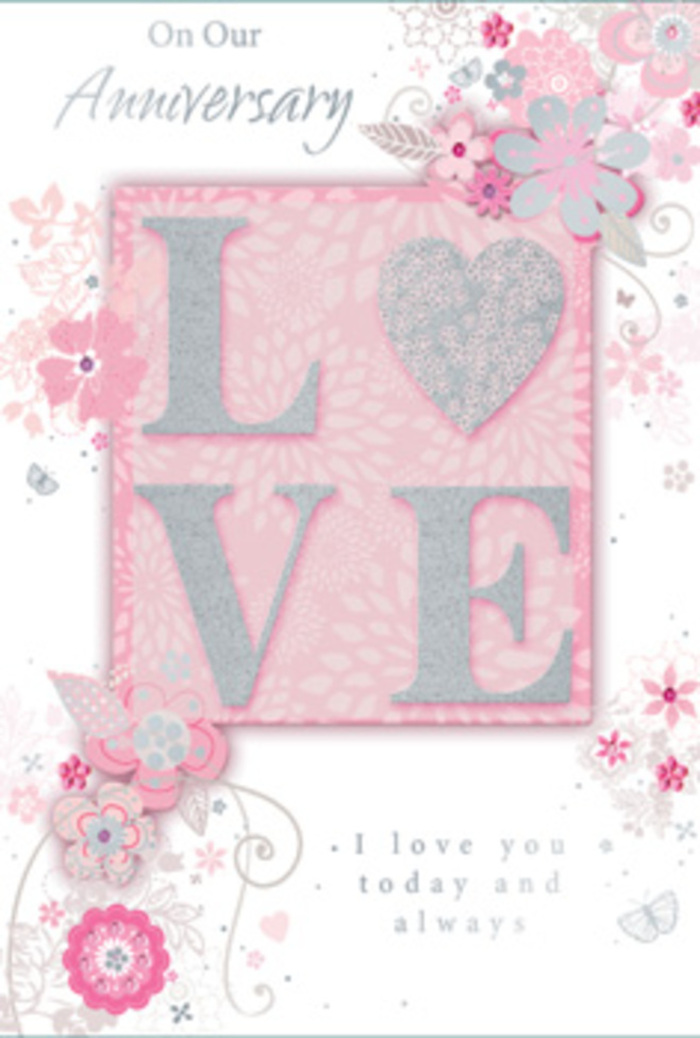 The anniversary card pictured here unfolds like a gentle love story, the kind a long-married couple in Harlesden might exchange after a quiet dinner at home. Dominating the design is the word LOVE, rendered in raised, frosted glitter that catches and scatters light, creating a soft sparkle without overwhelming the eyes. The letters feel almost sculpted, inviting touch and adding a tactile richness that mirrors the layered textures of a florist's bouquet. Around this centrepiece, wispy, hand-drawn flowers drift along the borders, their petals painted in tender shades of blush pink, lilac, and creamy ivory. The blossoms are interlaced with fine sprays of leaves and looping filigree lines, suggesting the same careful balance of height, texture, and negative space that a florist might plan when designing a romantic arrangement for a home near Roundwood Park or along Harrow Road. If you look more closely, you notice tiny, almost-hidden butterflies and delicate curls of foliage that add a sense of movement, like a soft breeze through the floral design. The background remains gently tinted in pink, diffusing the whole image in a warm, loving glow. In the midst of this, the message I love you today and always is set in a graceful, understated font that feels intimate rather than showy, as if spoken in a quiet, private moment. The overall effect is like a hand-tied bouquet expressed on paper-graceful, romantic, and thoughtfully composed, ideal for marking another year of shared life in NW10.